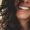 long black haired woman smiling close-up photography